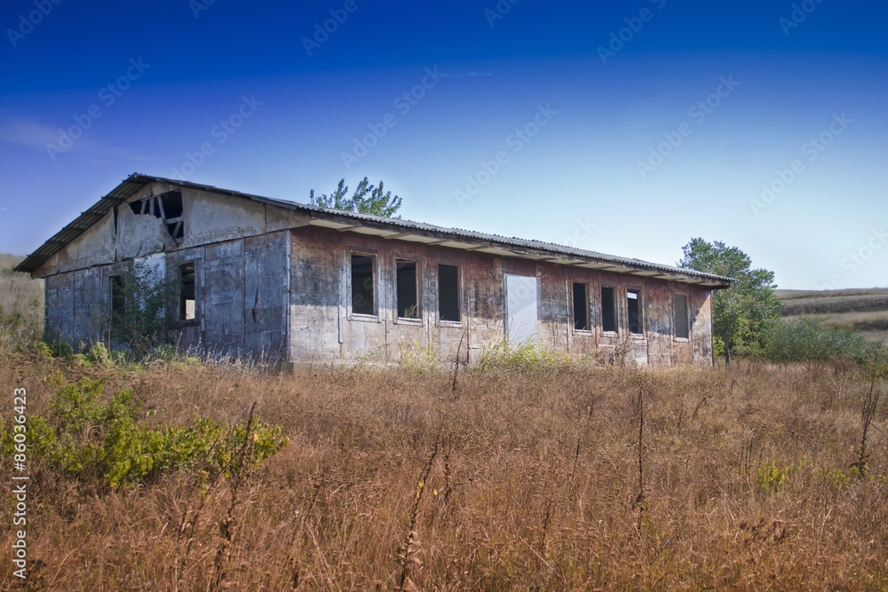 Abandoned building in a hilly area on a sunny day