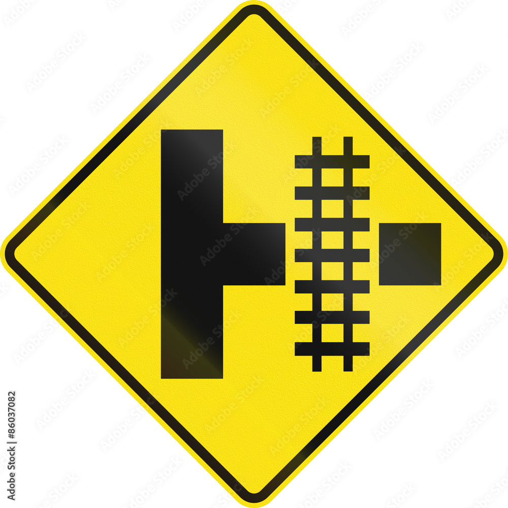 Warning road sign in Australia - Railroad crossing on the right