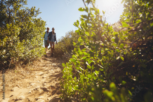 Young couple hiking on a summer day