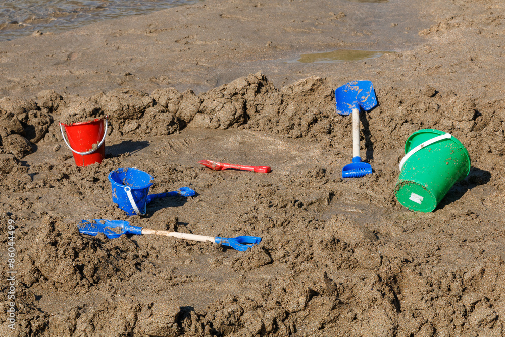 Buckets and spades on a sandy beach Buckets and spades on a sandy beach