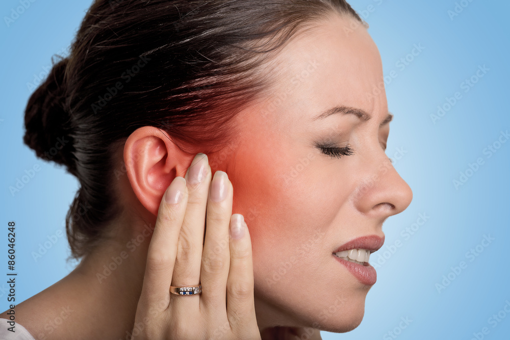 sick female having ear pain touching her painful head sick female having ear pain touching her painful head