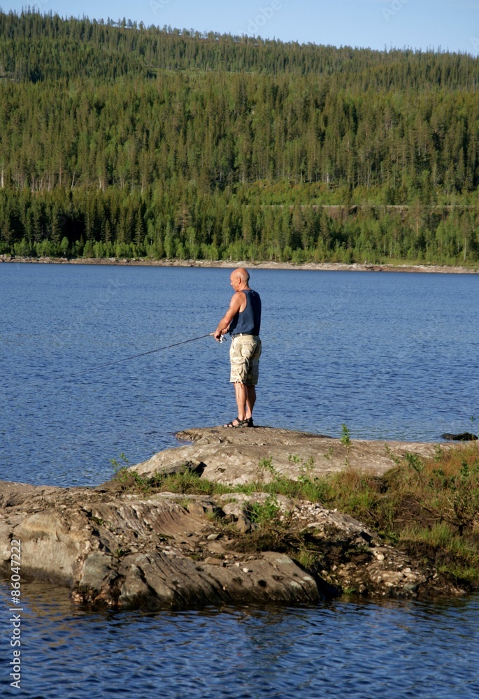 Man Fishing by a lake