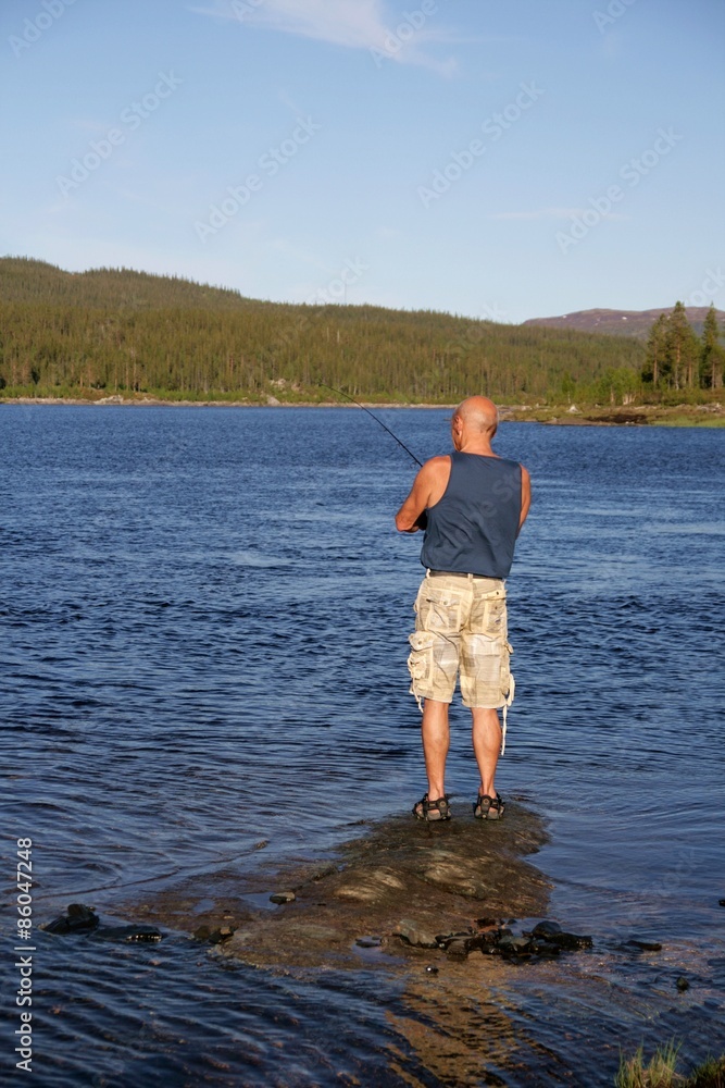 Senior Fishing by a lake