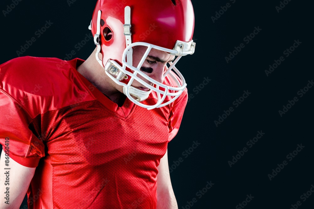 American football player taking his helmet on her head American football player taking his helmet on her head