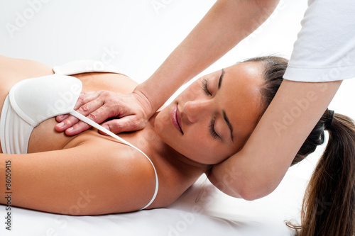 Woman having osteopathic neck massage. photo