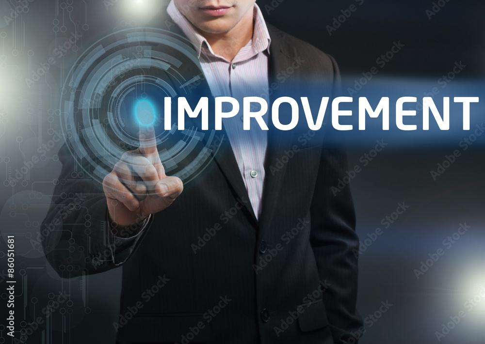 Businessman presses button improvement on virtual screens. Busi Businessman presses button improvement on virtual screens. Busi