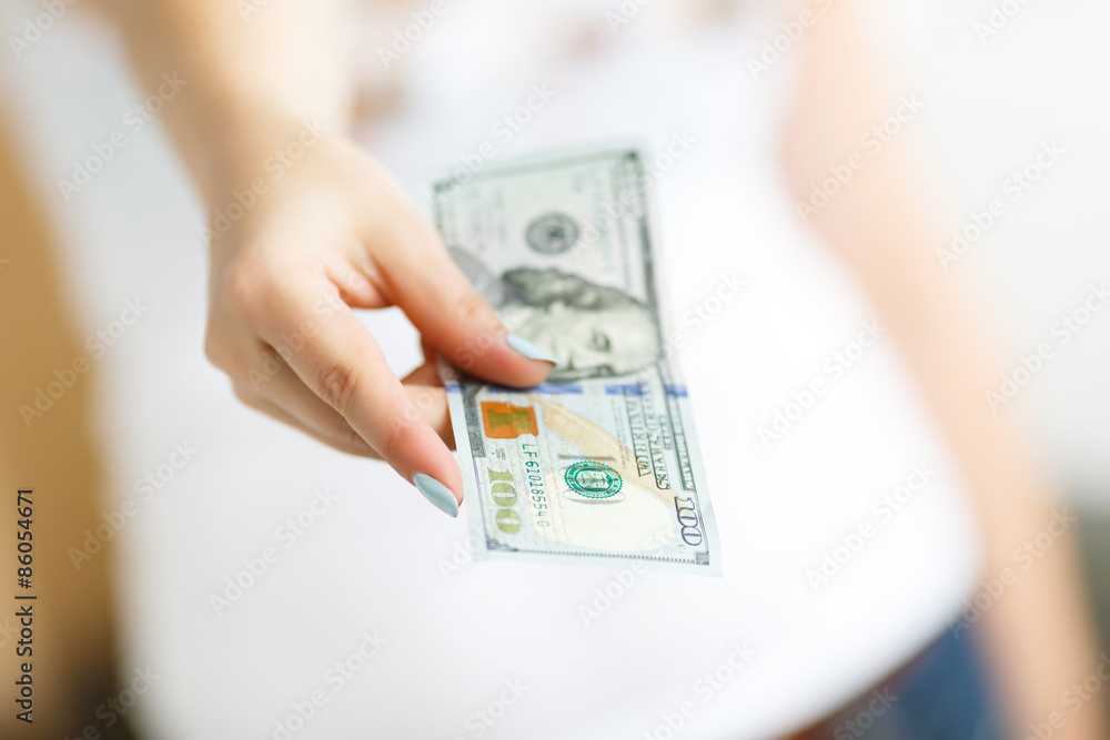 Hand of woman giving money