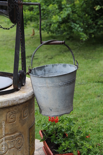 Bucket at the well / Bucket of a water well