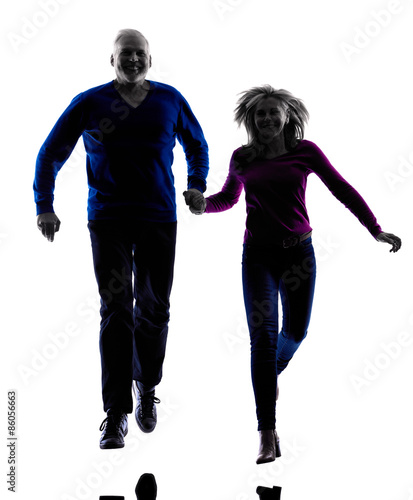 couple senior running jumping happy silhouette
