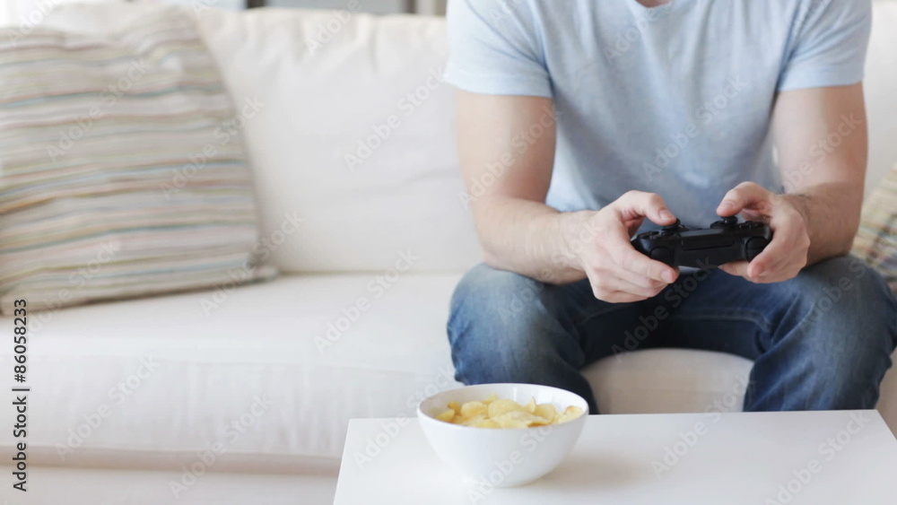 close up of man playing video game at home close up of man playing video game at home