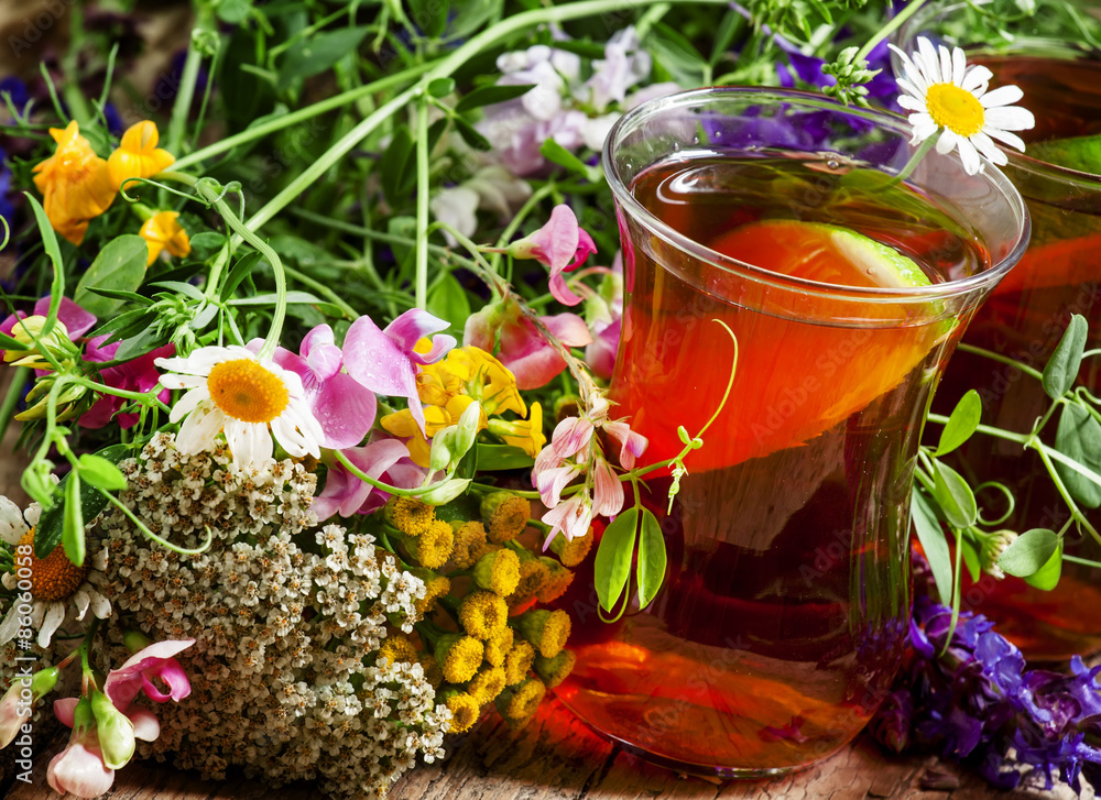 Black tea with lemon and herbs in an authentic Middle Eastern gl Black tea with lemon and herbs in an authentic Middle Eastern gl