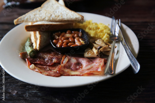 Photos Breakfast with ham , fried egg and bread on wood background low
