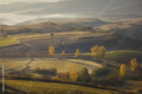 road through hills on autum...