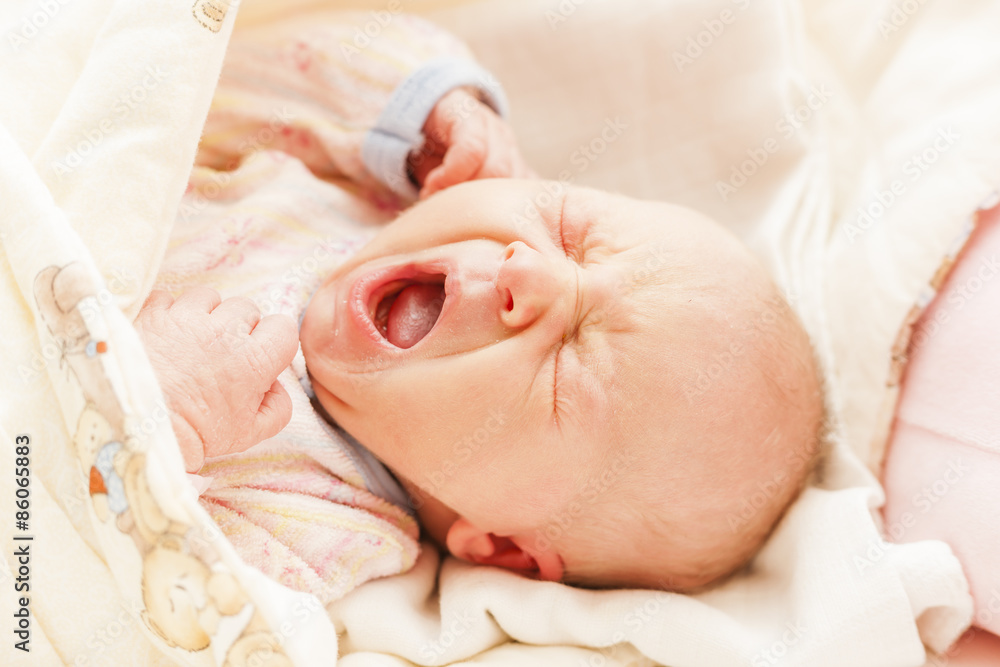 portrait of crying newborn baby girl portrait of crying newborn baby girl