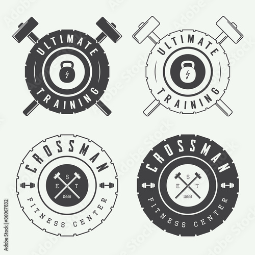 Set of gym logos, labels and slogans in vintage style
