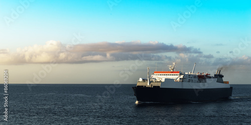 Ferry boat transporting passengers sailing sunrise in Trinidad and Tobago  © Altin Osmanaj