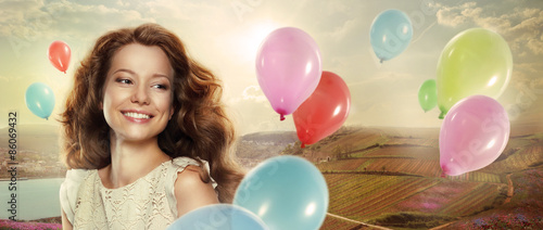 Holiday. Happy Woman with Colorful Air Balloons