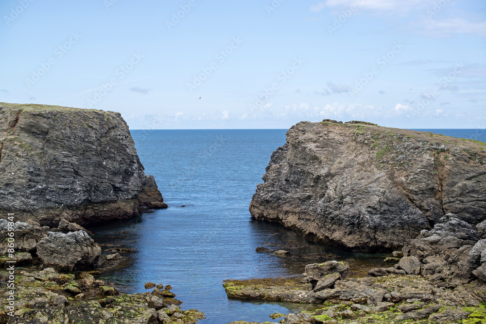 view of a cove of the wild coast of a brittany island during summer