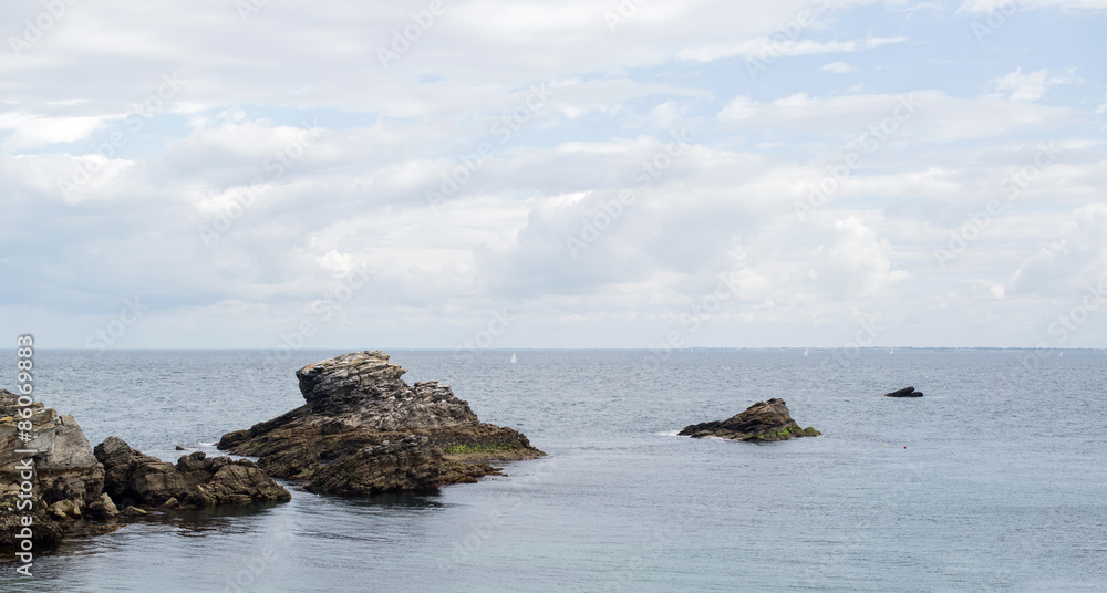 view of the wild coast of a brittany island during summer