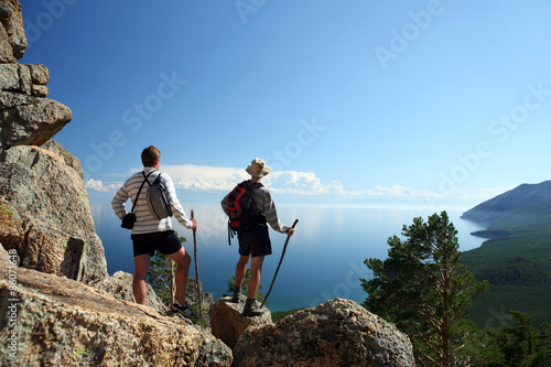 Two tourists admiring the view from the mountain