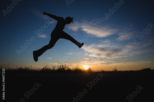 man jumping in sunset © Alex Koch