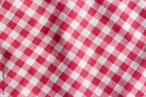 Red picnic tablecloth background. Red and white fabric texture.