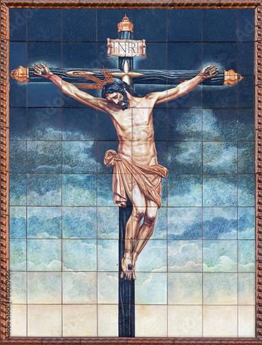 Granada - ceramic tiled Crucifixion on the facade of St. Cecilio photo