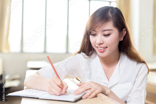 Asian beautiful female student study portrait in classroom