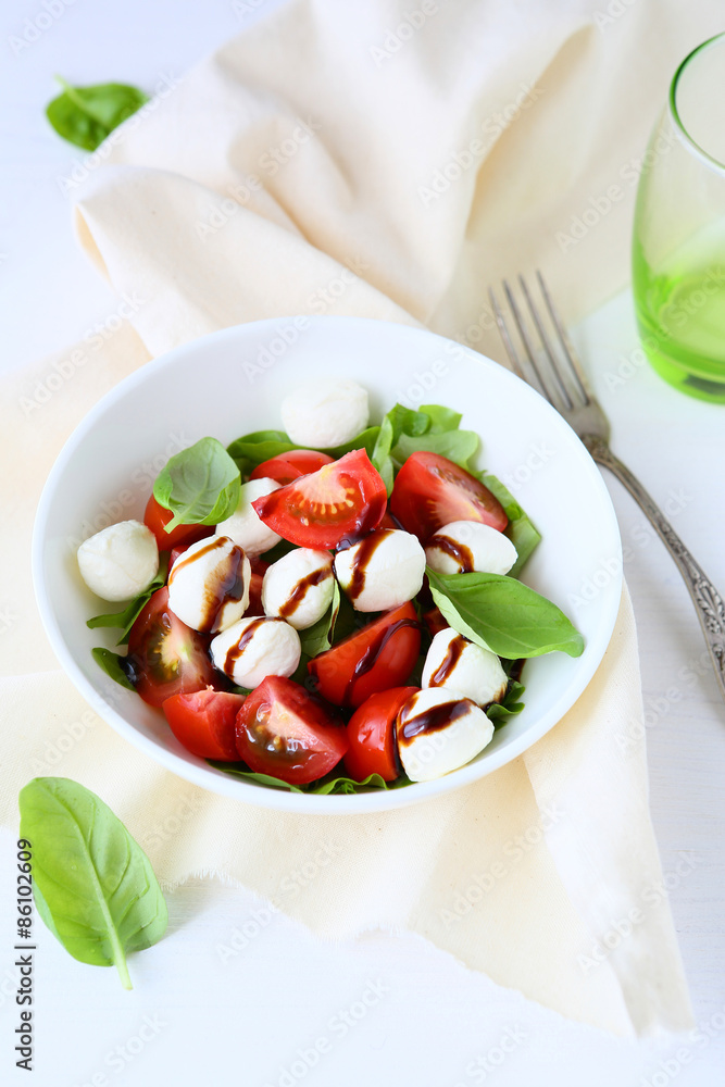 fresh salad in white bowl, italian caprese salads fresh salad in white bowl, italian caprese salads