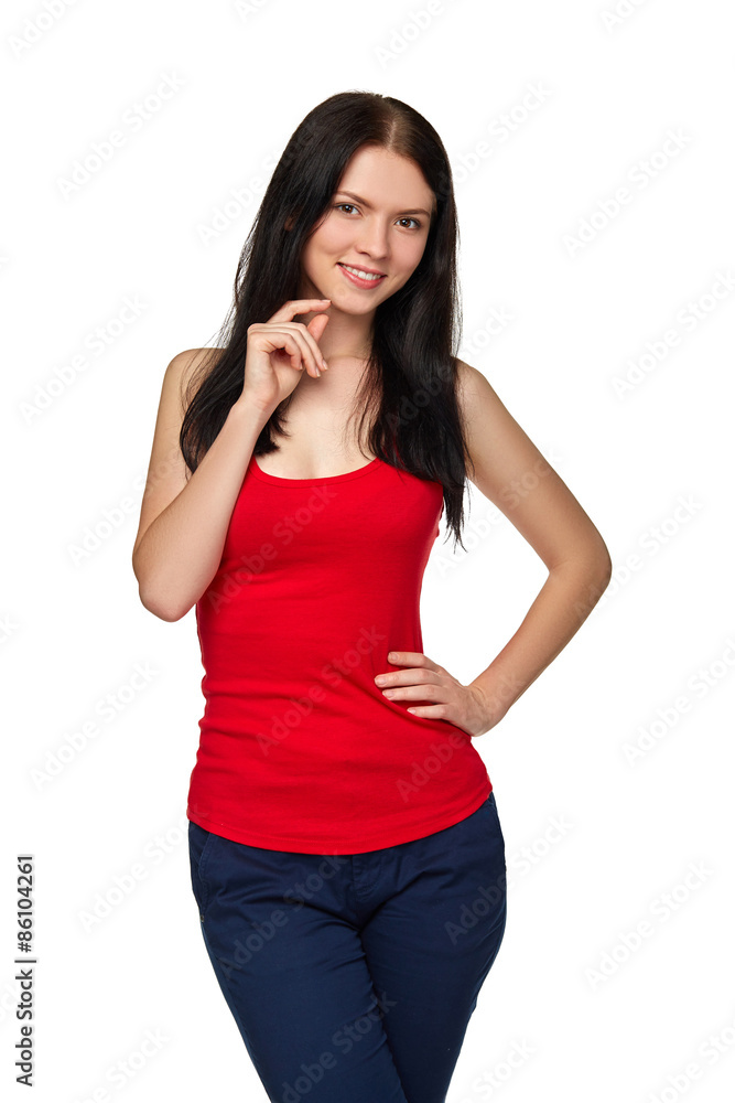 Smiling casual female in jeans and red tshirt standing relaxed w Smiling casual female in jeans and red tshirt standing relaxed w