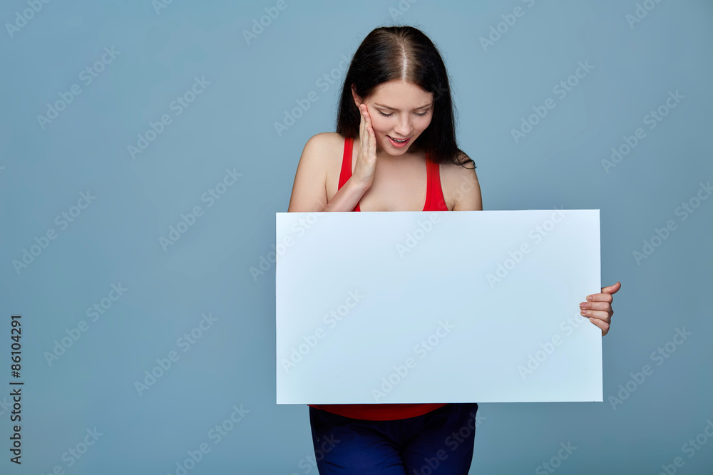 Beautiful woman standing behind, holding white blank advertising Beautiful woman standing behind, holding white blank advertising