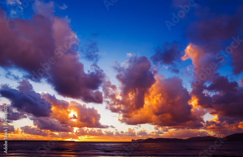 dramatic sky over Alghero shoreline at sunset