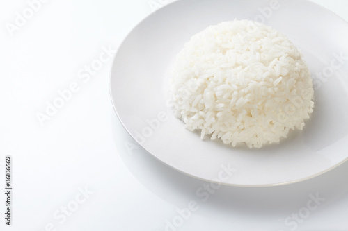 Rice on white plate isolated on white background