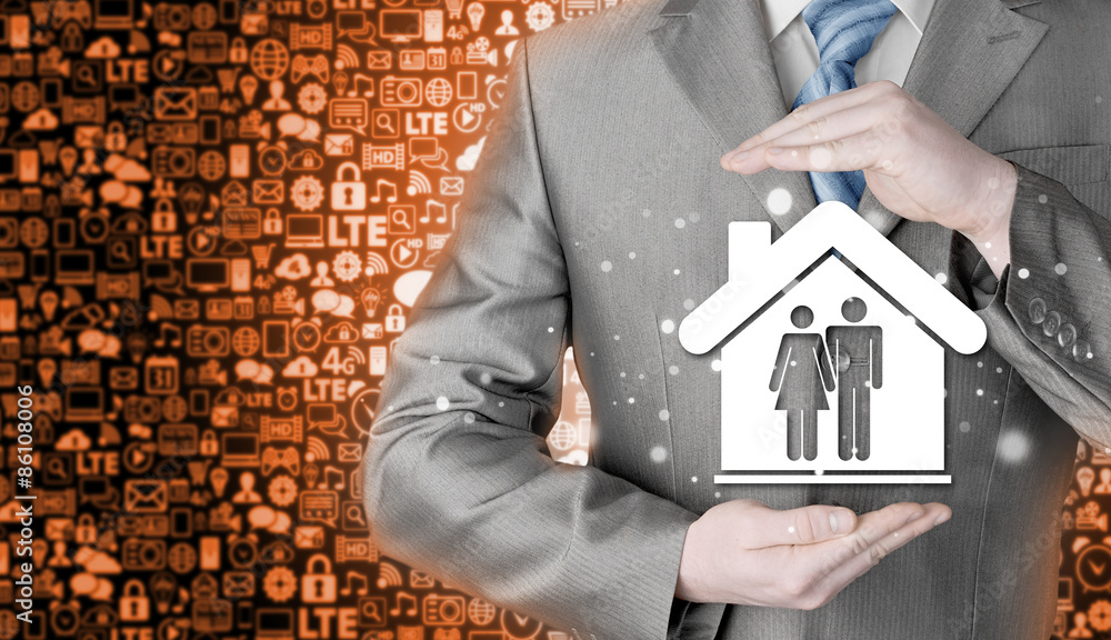 businessman protecting family in home with hands businessman protecting family in home with hands