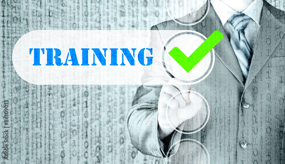Businessman pressing touch screen interface training checkbox Businessman pressing touch screen interface training checkbox