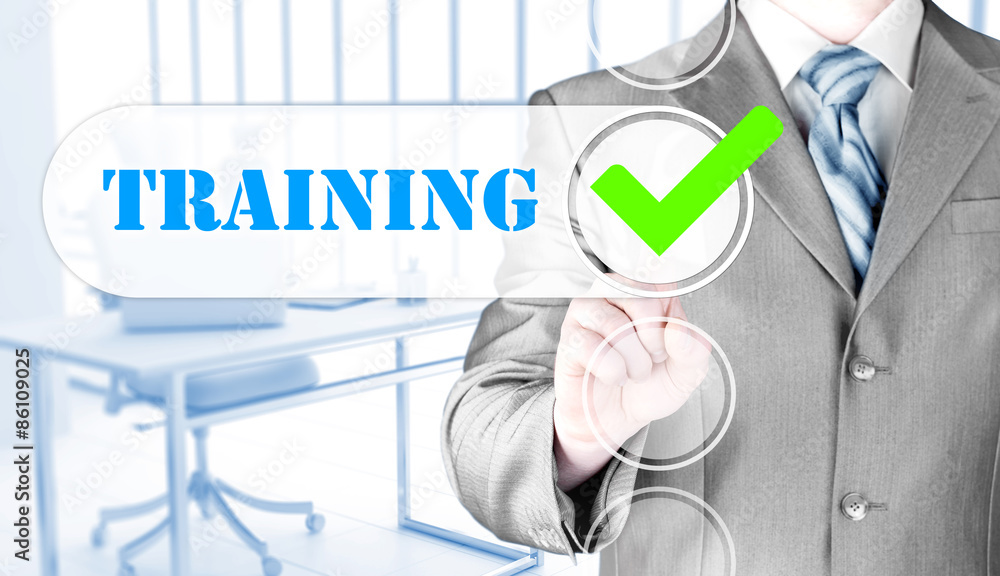 Businessman pressing touch screen interface training checkbox Businessman pressing touch screen interface training checkbox