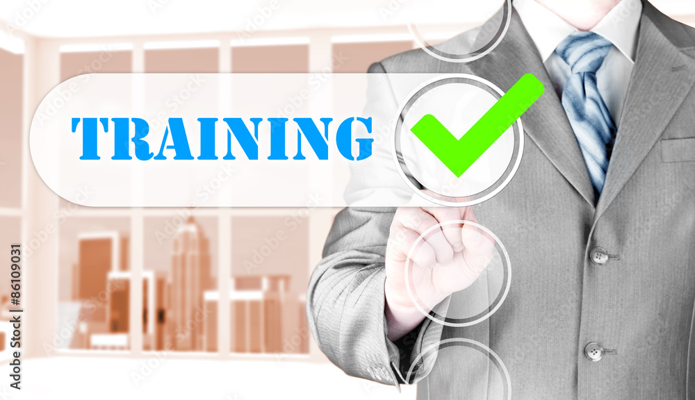 Businessman pressing touch screen interface training checkbox Businessman pressing touch screen interface training checkbox