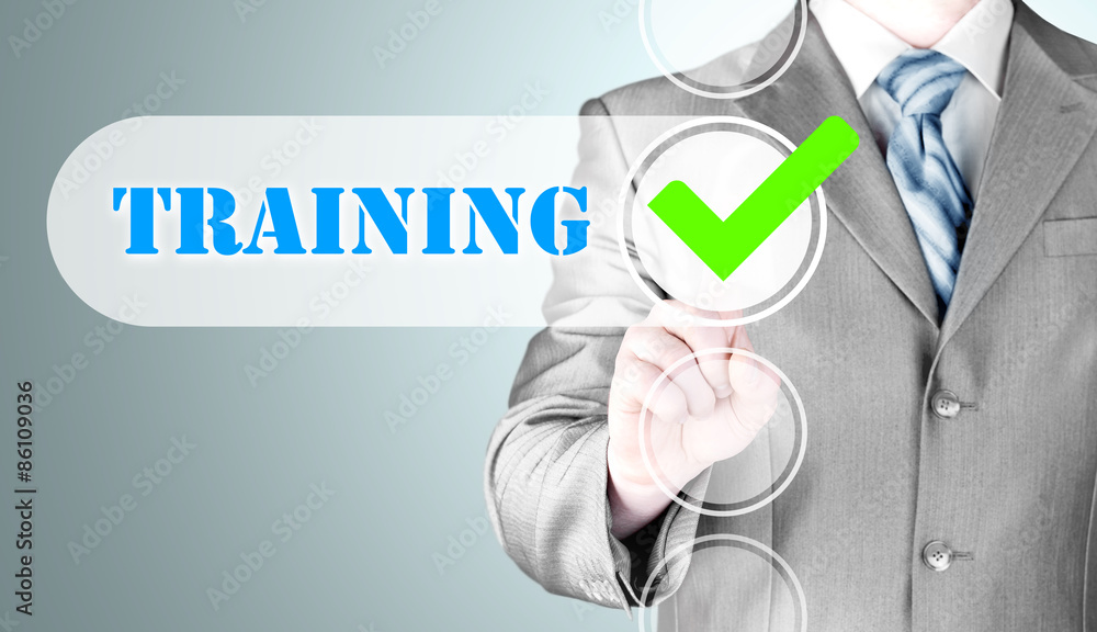 Businessman pressing touch screen interface training checkbox Businessman pressing touch screen interface training checkbox