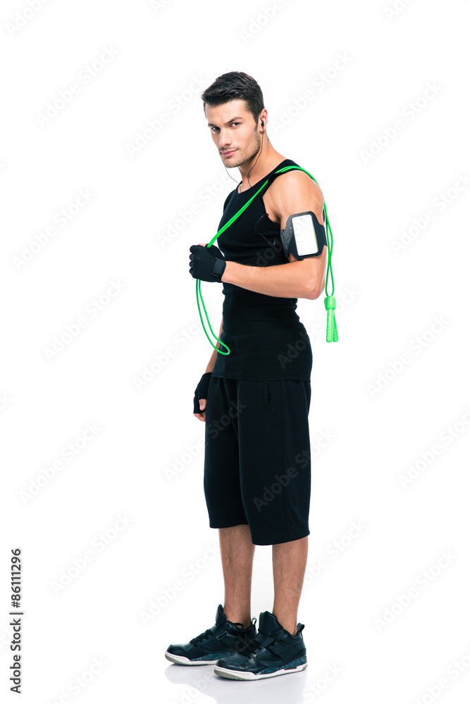 Confident fitness man holding skipping rope Confident fitness man holding skipping rope