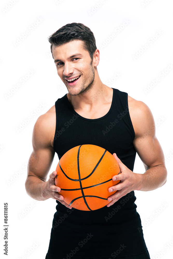 Cheerful basketball player standing with ball Cheerful basketball player standing with ball