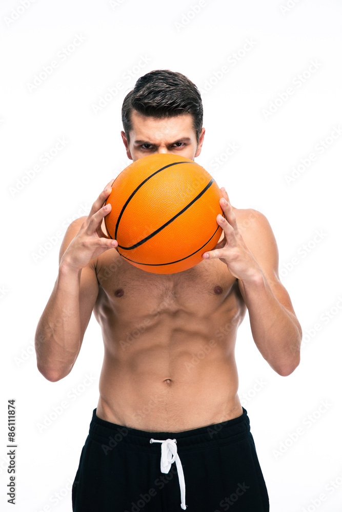 Portrait of basketball player holding ball Portrait of basketball player holding ball