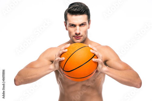 Portrait of a handsome man playing in basketball