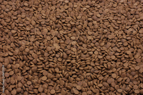 Dry pet food (dog or cat) brown background