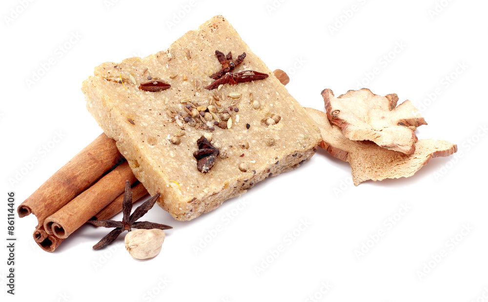 handmade soap with cinnamon and anise star on white background handmade soap with cinnamon and anise star on white background