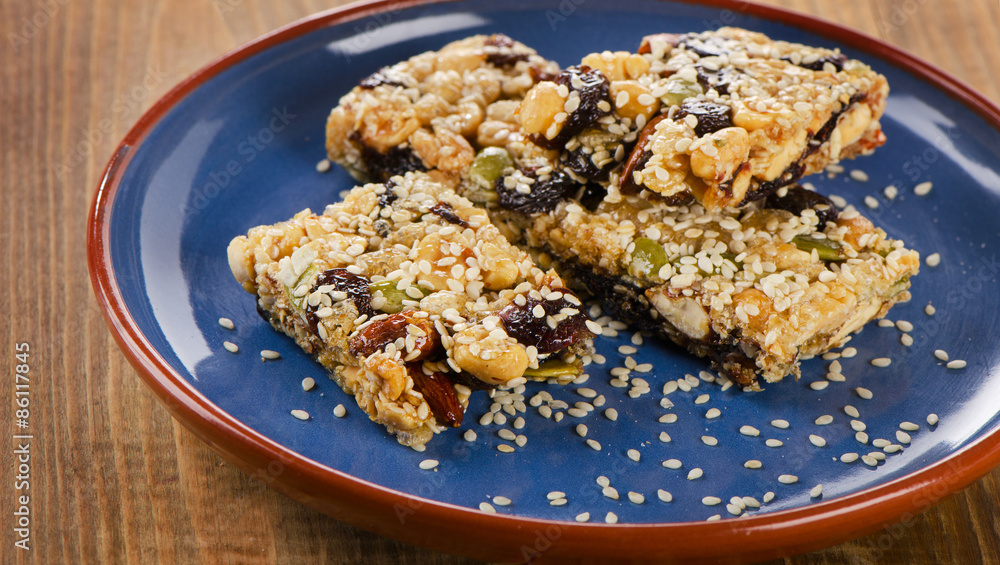 Healthy granola bars on a blue plate Healthy granola bars on a blue plate