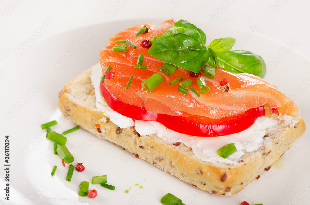 Sandwich with cereals bread and salmon on plate. Sandwich with cereals bread and salmon on plate.