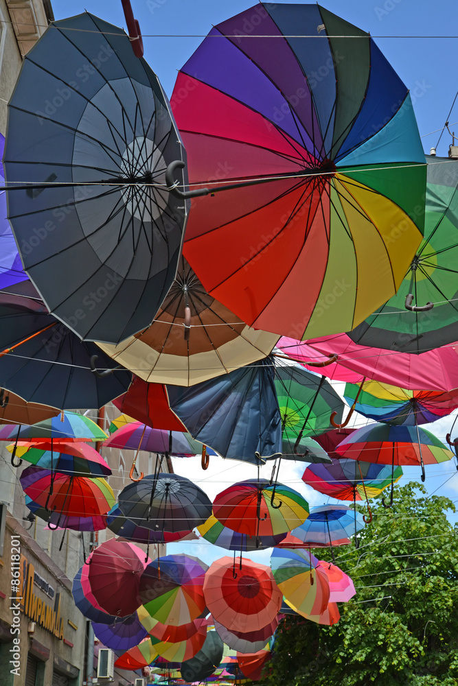 GUSEV, RUSSIA - JUNE 04, 2015: Color umbrellas hang on the stree