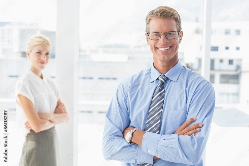 Smiling business partners looking at camera Smiling business partners looking at camera