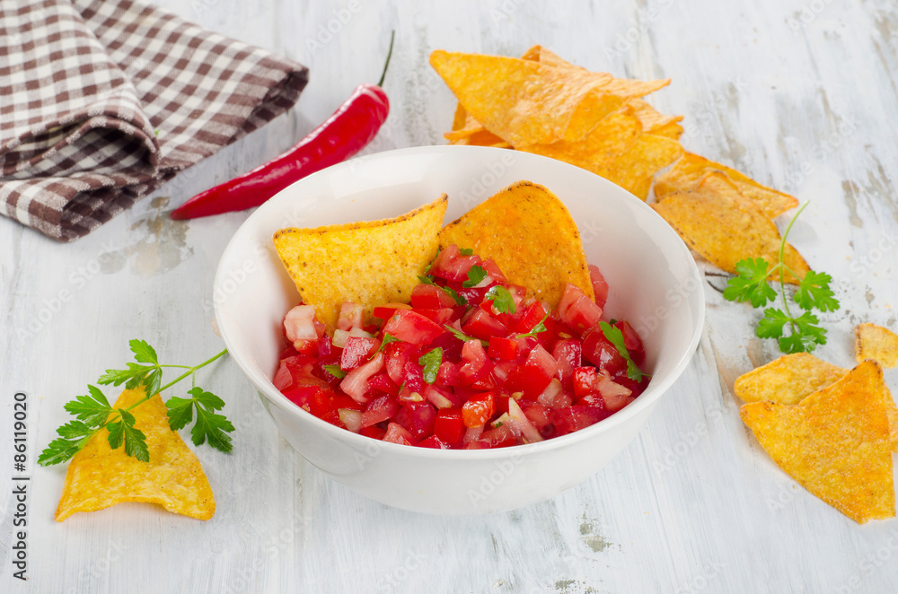 Bowl of homemade salsa dip with chips. Bowl of homemade salsa dip with chips.