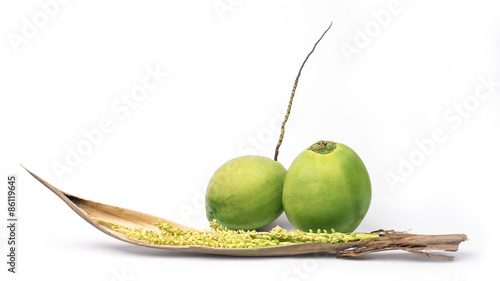 Coconut with spadix isolated on white background